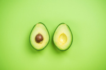 Avocados halves creative food concept
