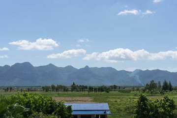 landscape with mountain view on horizon and blue clouds sky., natural background