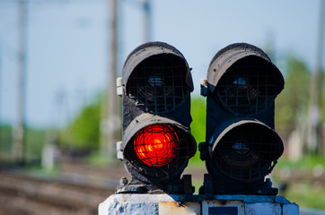 Red shunting light at the railway next to another one switched off