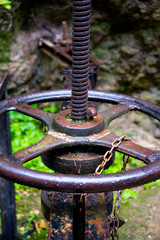 irrigation sluice system with rusty shutoff wheel in ronda, andalusia, spain