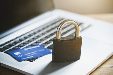 Lock with credit card and laptop. Safe online shopping and protected paying concept - 203966058