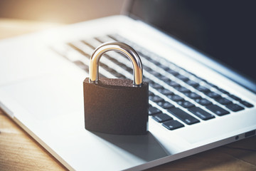 Lock on laptop as computer protection and cyber safety concept. Private data protection from hacker malware