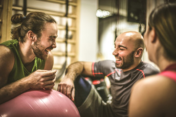 Group of people exercise together.