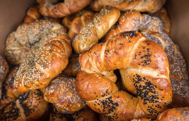 fresh sesame and poppy seeds bagels or pretzels for sale at local farmers market