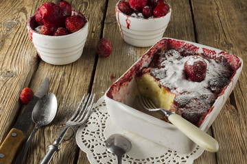 Cheesecake, garnished with berries, mint and peach