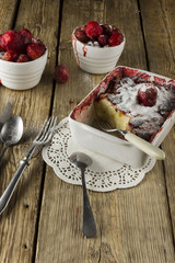 Cheesecake, garnished with berries, mint and peach