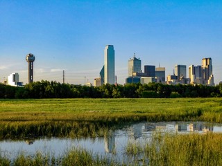 Fototapeta na wymiar Downtown Dallas Skyline, clear sky, pond reflection