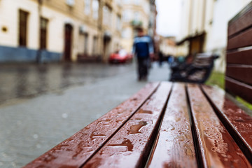 went bench after rain. rainy weather. copy space