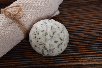 lonely relaxation ball for bath white clean towel on a brown background with free space for text