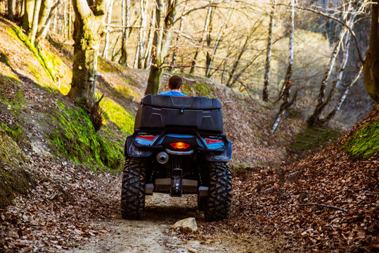 man ride ATV in the forest trail. journey concept