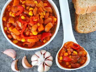 Beans with garlic in Mexican style in a white bowl