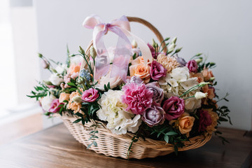 Beautiful colourful blossoming basket of fresh blossoming flowers, close up view 