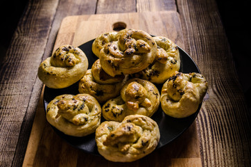 Dough dainted by the woman on the board