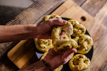 Dough dainted by the woman on the board