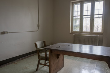 Empty chair and desk in room