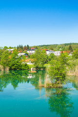 Fototapeta na wymiar Beautiful village of Belavici on the bank of Mreznica river, countryside landscape, Croatia 