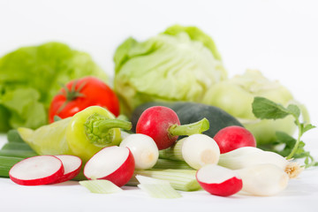 Spring vitamin set of various green leafy vegetables on white background