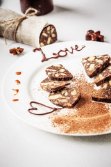 Homemade sweet chocolate sausage cut into pieces