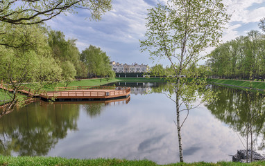Spring landscape. Moscow. Meshchersky pond. River Navershka and residential complex 