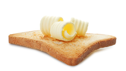 Toast with tasty butter curls on white background