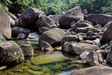 Fototapeta na wymiar Photo of a mountain river in China among large stones.
