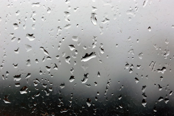 Rain drops on a window, stormy weather.