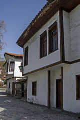Fototapeta na wymiar Ancient residential district with narrow alley and authentic architecture from hoary antiquity Varosha, Blagoevgrad, Bulgaria