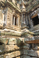 Walls of the ancient Thommanon Temple, decorated with Buddha, in the Angkor Area, near Siem Reap, Cambodia, Asia. Buddhist monastery from the 12th century. Asian architectural background.