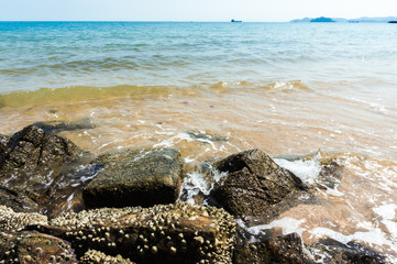 Beach rocks and stones and sea on tropical beach