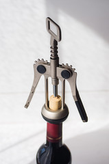 bottle opening with a corkscrew