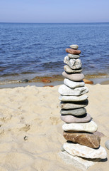 pyramid of stones against the sea