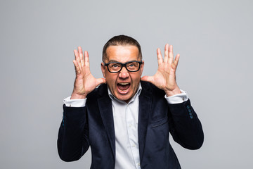 Announcing good news. Happy young man in formalwear shouting while looking at camera and standing isolated on white background