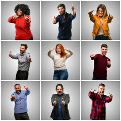 Obraz premium Group of mixed people, women and men stand happy and positive with thumbs up approving with a big smile expressing okay gesture