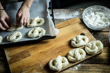 Dough dainted by the woman on the board