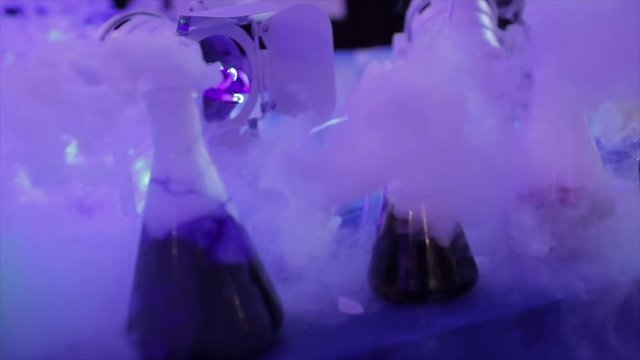 Magical witch lab with blue light and potion for Halloween in slow motion