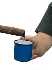 Cropped Hand Of Man Cup Under Pipe Against White Background