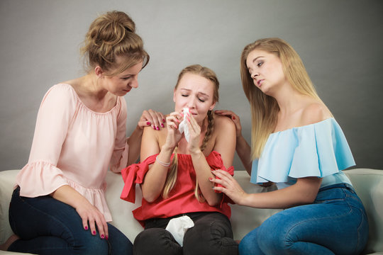 Friends helping woman during fever.