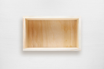 Naklejka na ściany i meble Wooden box on white table top view