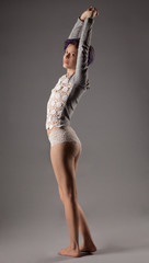 Stretching Woman in Lacy Sweater and Panties
