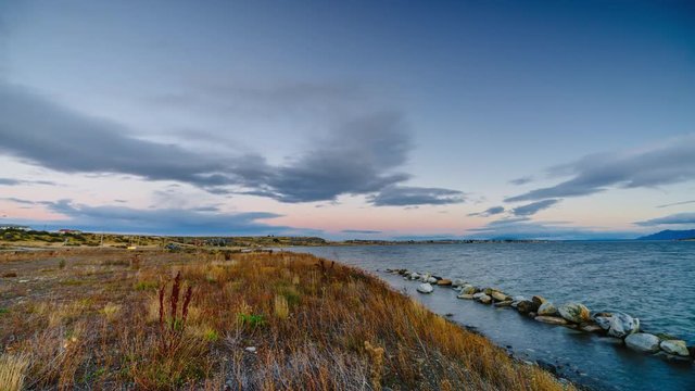 View on the bay during sunset at Puerto Natales . Autumn in Patagonia, the Chile side