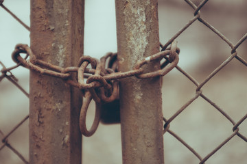 close-up of fence with lock. concept of horrors of concentration camp