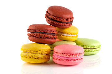 Macaron cakes of different colors on a white background