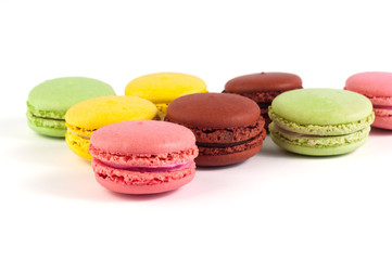 Macaron cakes of different colors on a white background