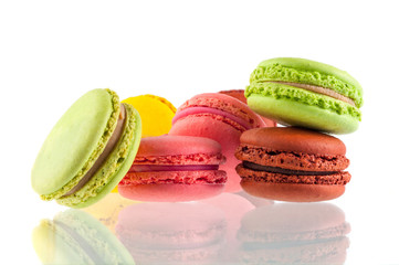 Macaron cakes of different colors on a white background