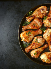 Grilled chicken legs with thyme.