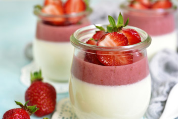 Vanilla strawberry panna cotta in a vintage jars.