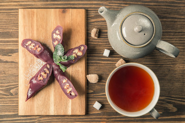 Churchkhela sucrose on wooden table. Georgian sweet dessert . Churchkhela - traditional Georgian sweetness food. Copy space
