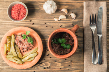 Georgian national dish pate in a plate with cucumber
