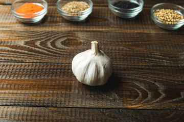 garlic lies on a wooden background