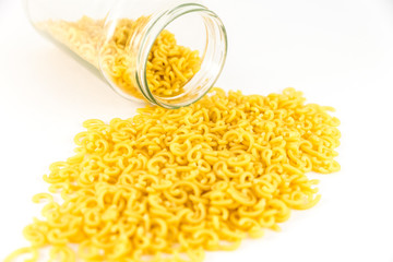 Raw pasta fideuà on white background